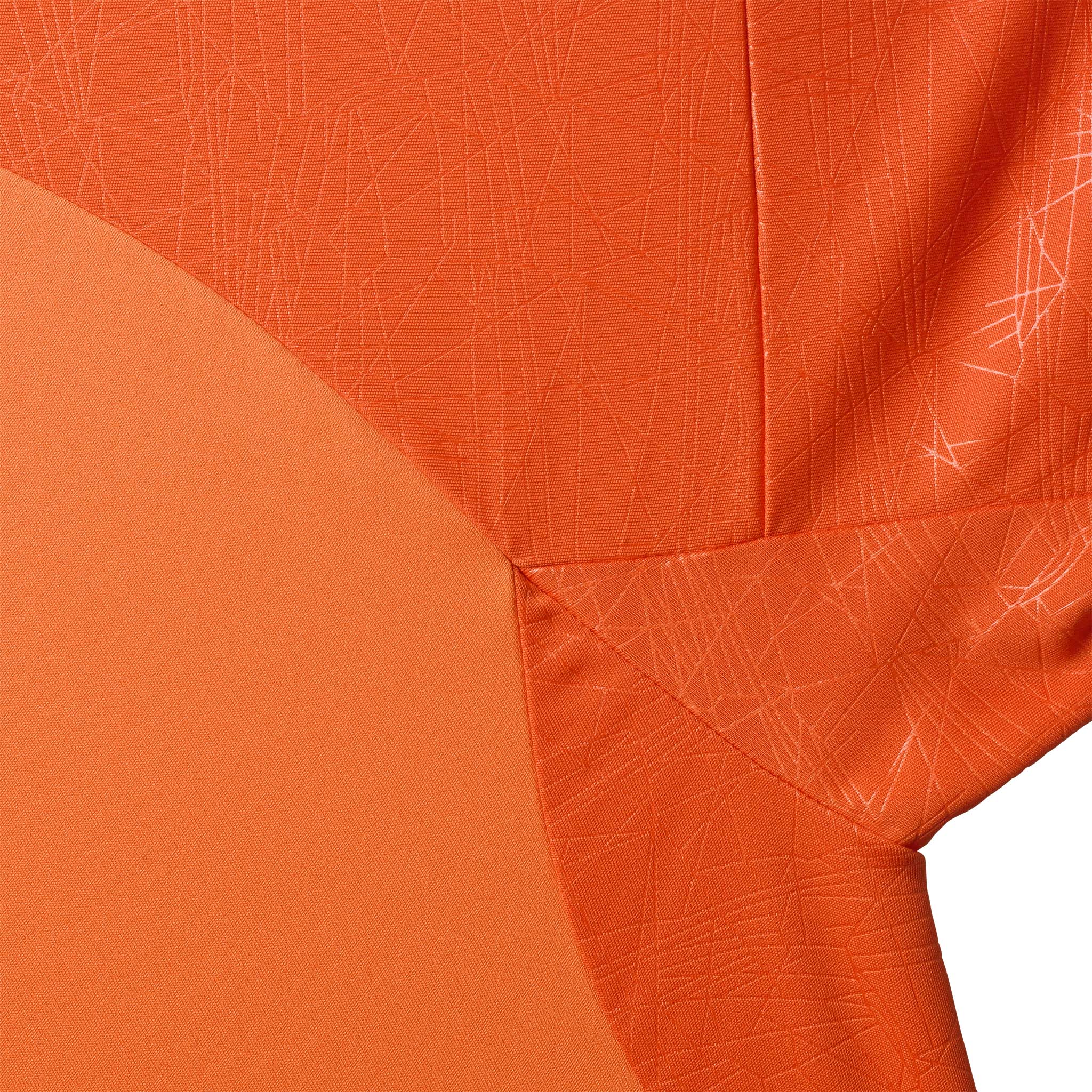 Nærbillede af Player shirt S/S Spain v25, Match & Training wear, i orange med diskret struktureret mønster.
