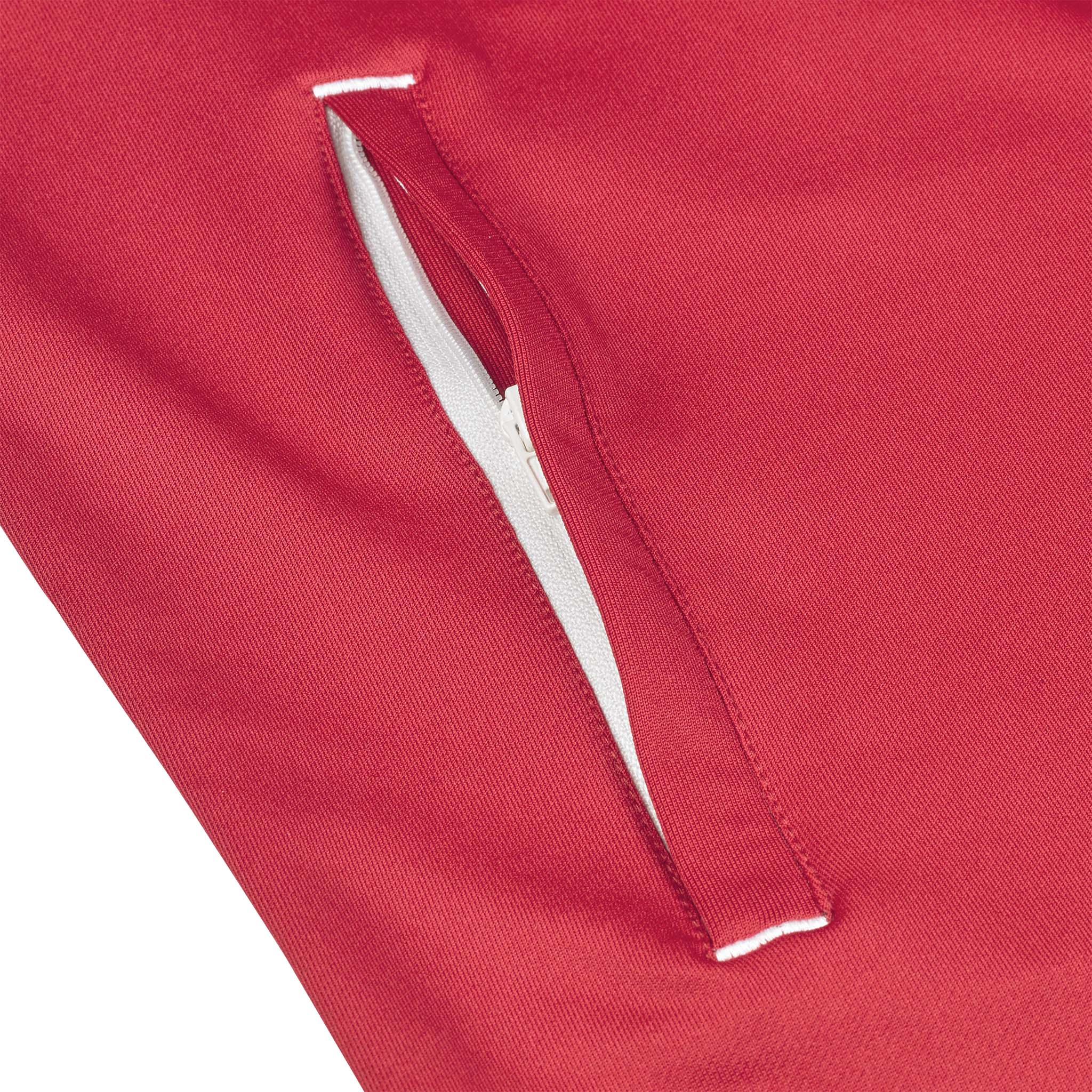 Nærbillede af rød Training zip jacket Spain woman v25, Match & Training wear, med hvid lynlåslomme.